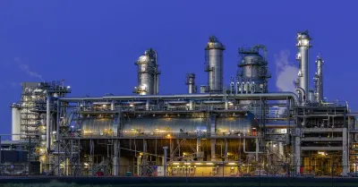 A gas-fired power generation facility at dusk, representing energy infrastructure