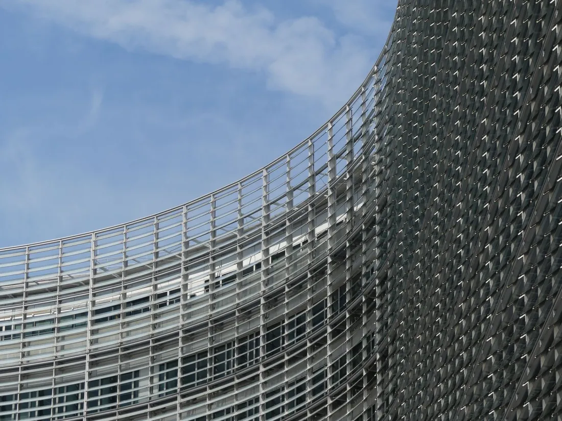 Curved facade of the European Commission's Berlaymont building in Brussels, illustrating what the EU regulations on foreign subsidies are