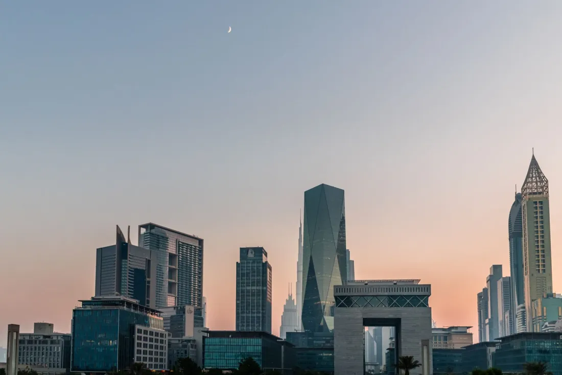 Dubai financial district skyline at dusk, where the Banque Misr UAE branches targeted by secondary sanctions on Iran operate