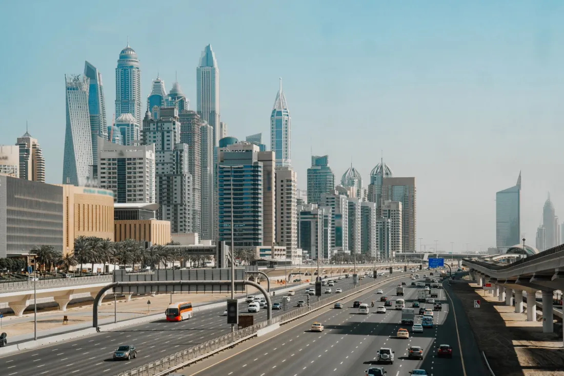 Dubai skyline and highway, illustrating what a domestic minimum top-up tax means for multinationals in the UAE