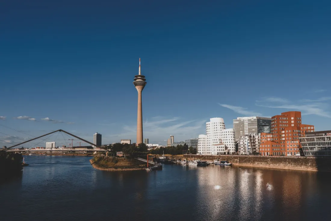 Düsseldorf skyline and Rhine Tower on the river, home of the UPC local division, illustrating what UPC patent litigation is
