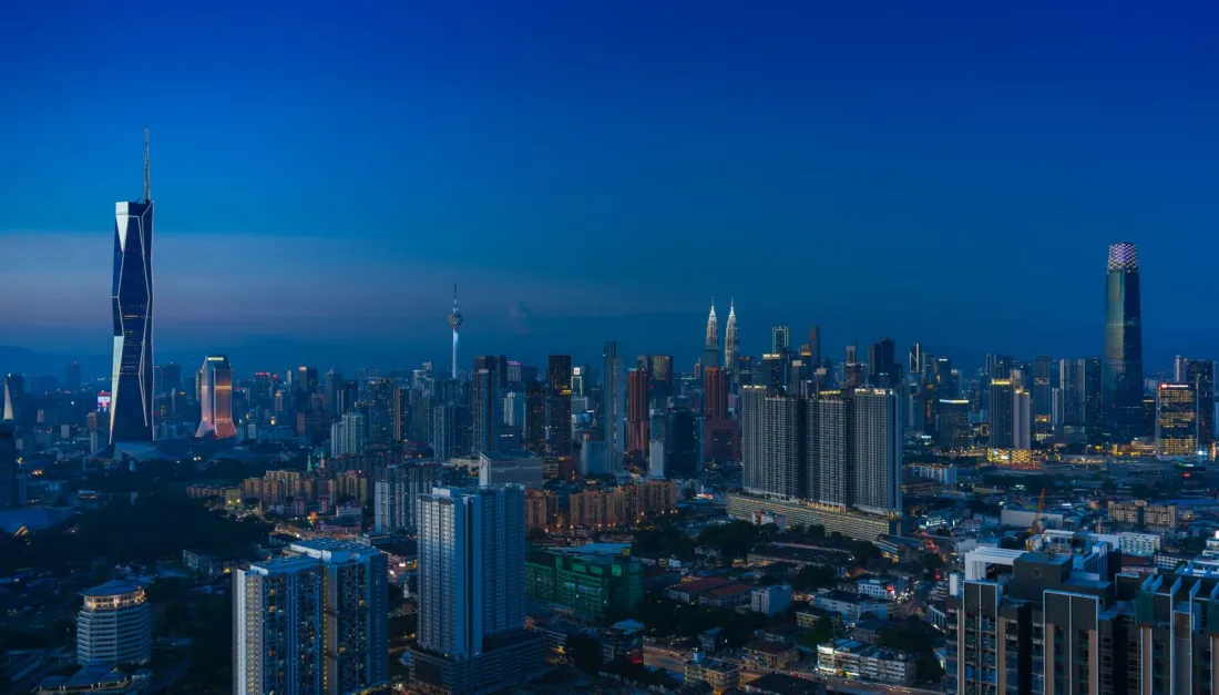 Kuala Lumpur skyline at dusk, where the Malaysia Cross-Border Insolvency Act 2026 now governs recognition of foreign insolvency proceedings