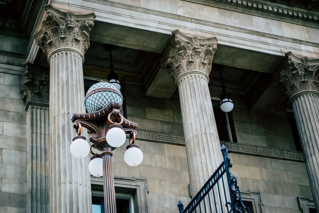 Classical court building columns, representing the High Court's role in recognising foreign main proceedings under the Malaysia Cross-Border Insolvency Act 2026