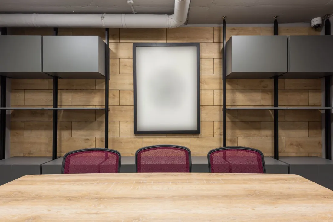 Empty boardroom table and chairs, representing the governance and senior management expectations for crypto firms seeking FCA authorisation