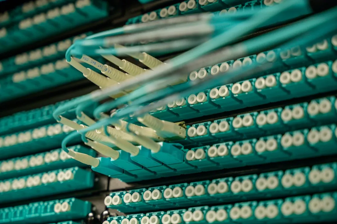 Fibre optic cables plugged into a data centre patch panel, illustrating whether the Data Privacy Framework is still valid for EU-US data transfers