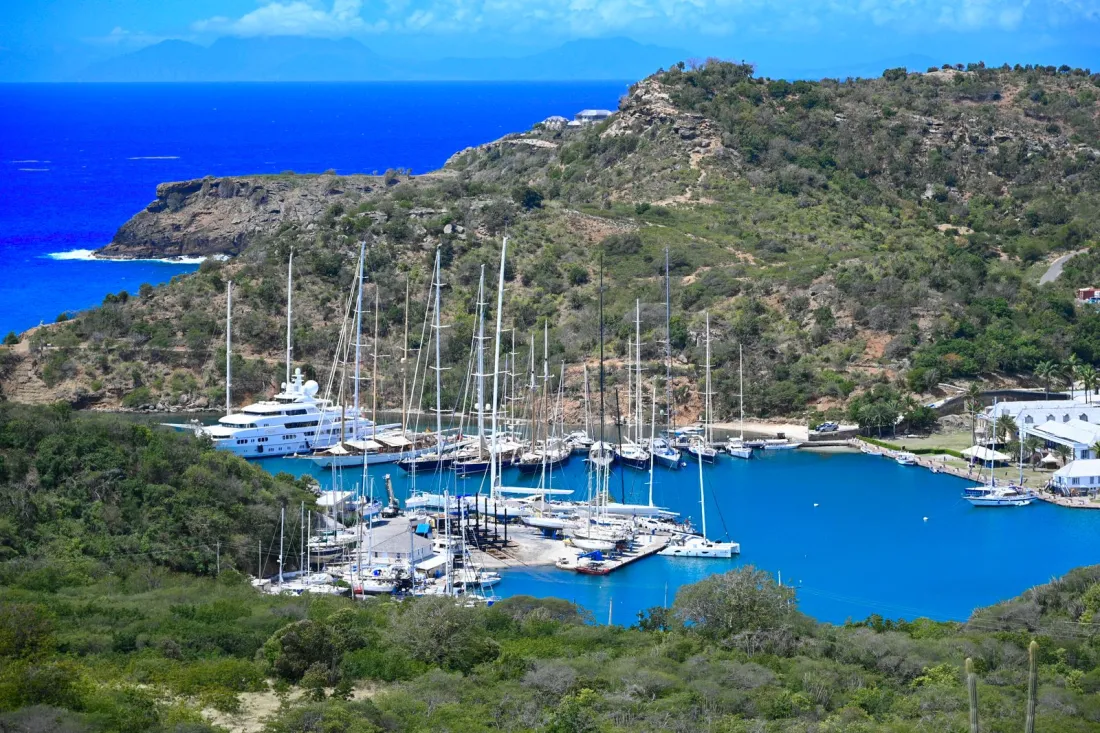 Yachts moored in a sheltered Caribbean harbour, illustrating EU pressure on Caribbean citizenship by investment under the visa suspension mechanism