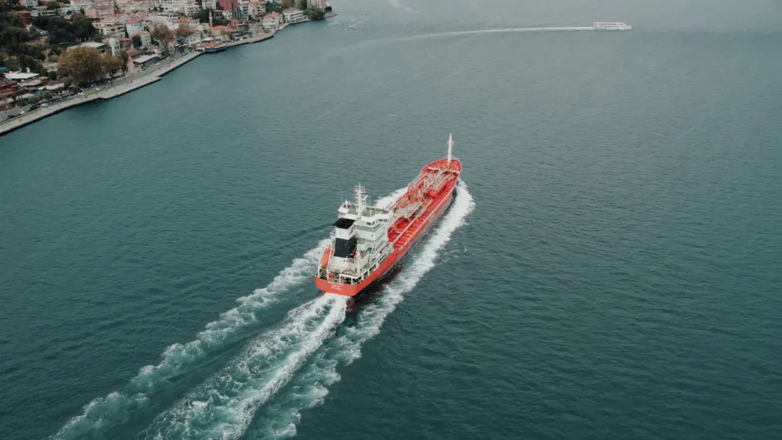Red product tanker sailing through the Bosphorus, the gateway to the Black Sea war risk listed area