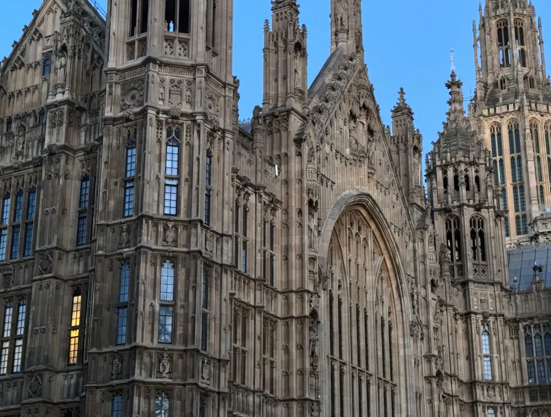 Gothic stonework of the Palace of Westminster, where Parliament passed the Investigatory Powers Act 2016 at the centre of the Apple case