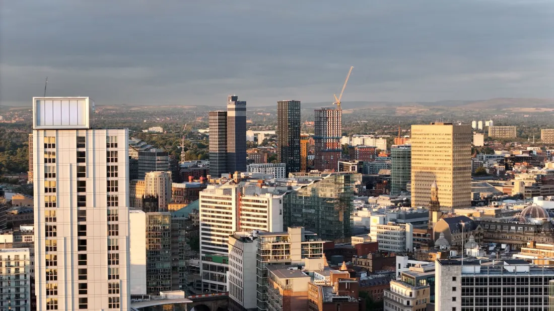 Manchester city centre skyline at sunset, where clubs suing Man City for compensation may test the Everton v Burnley precedent