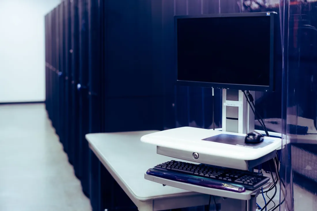 Data centre server racks beside a workstation, illustrating whether Google shares your search history under the EU Digital Markets Act