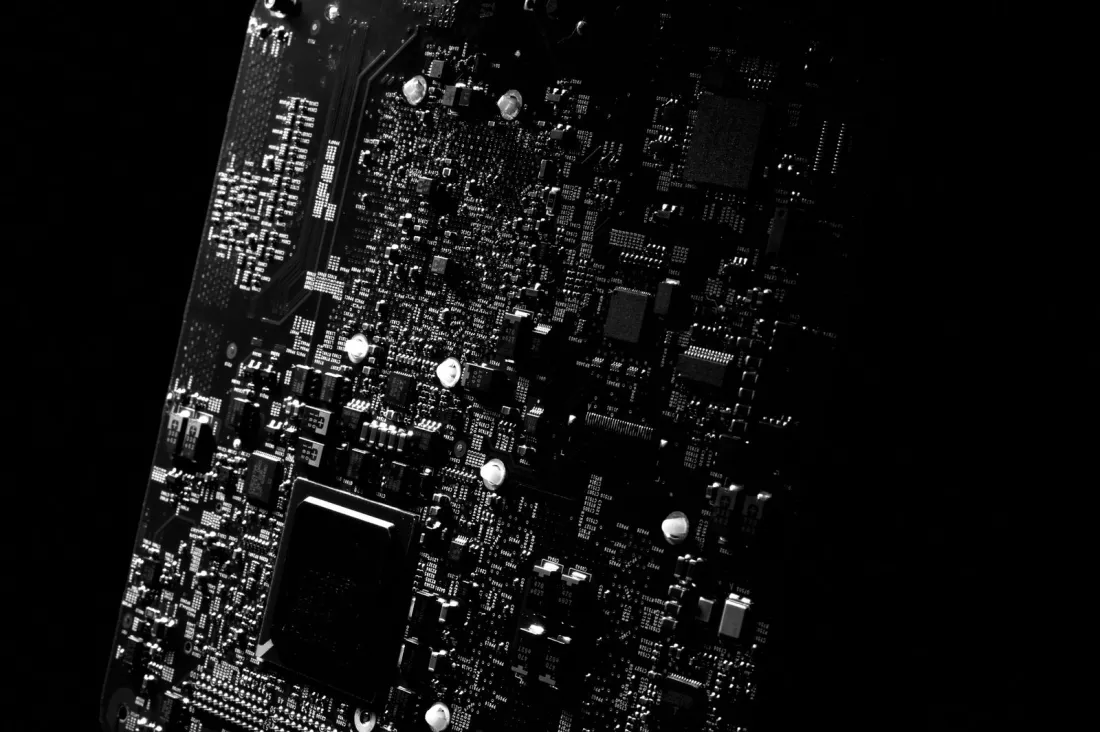 Close-up of a circuit board in black and white, illustrating how ROSS trained a non-generative AI model on material built from Westlaw headnotes