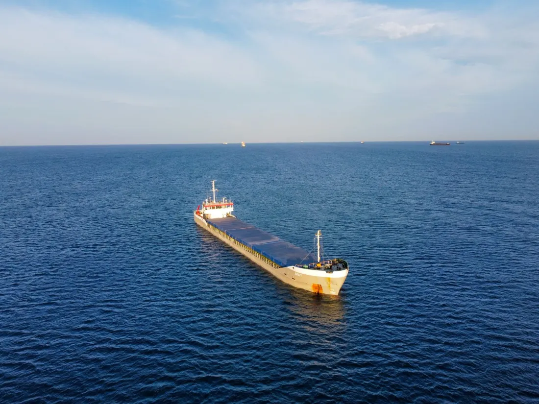 General cargo ship at sea, representing the Admiralty Court and Commercial Court moving into the Business and Property Division