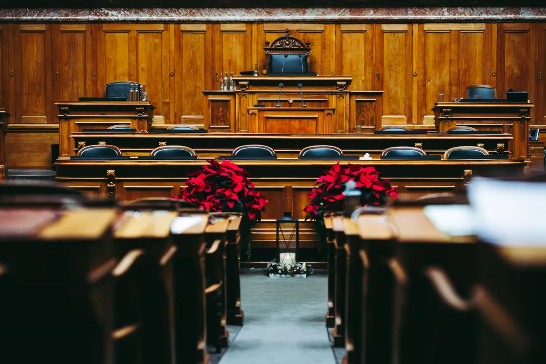 Empty wood-panelled courtroom, illustrating the Competition Appeal Tribunal trial of the Google Play Store class action lawsuit