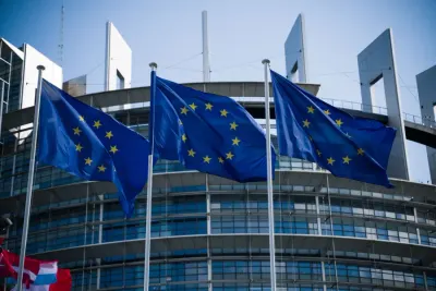 EU flags flying outside the European Parliament in Strasbourg, illustrating MiCA licence requirements for crypto firms in the EU