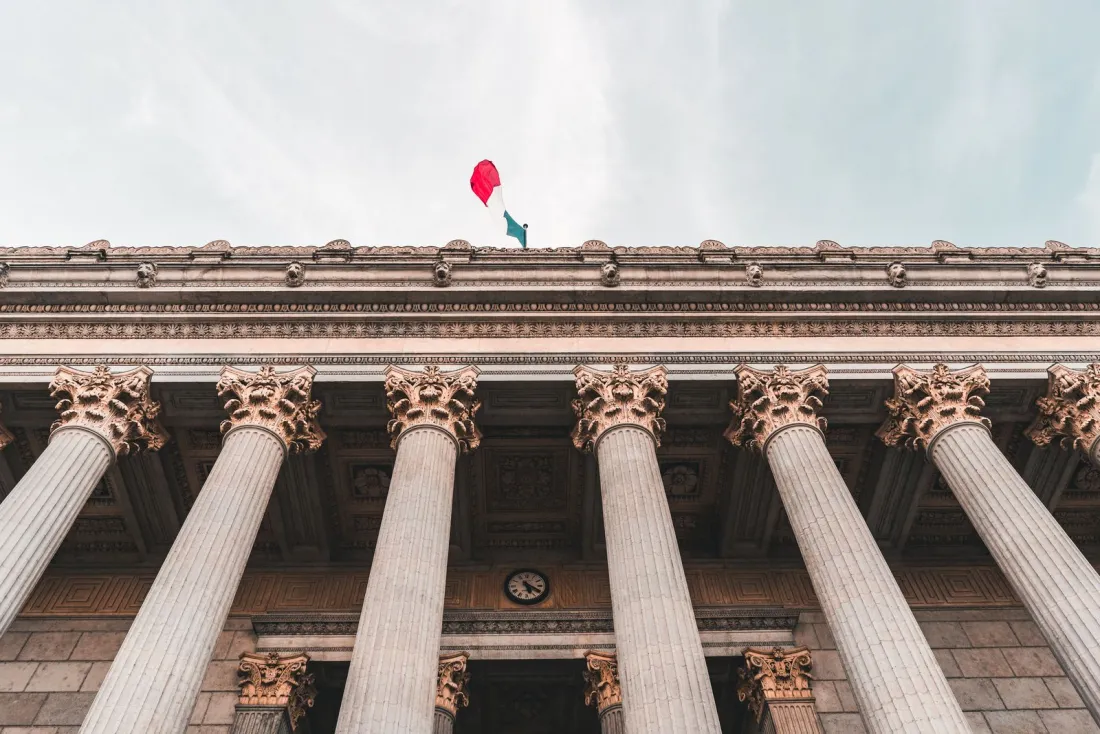 Columns of the Palais de Justice in Lyon seen from below, illustrating how to enforce a foreign judgment across borders