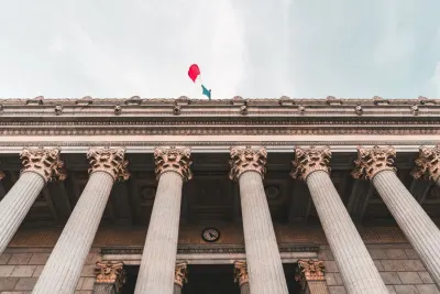 Columns of the Palais de Justice in Lyon seen from below, illustrating how to enforce a foreign judgment across borders
