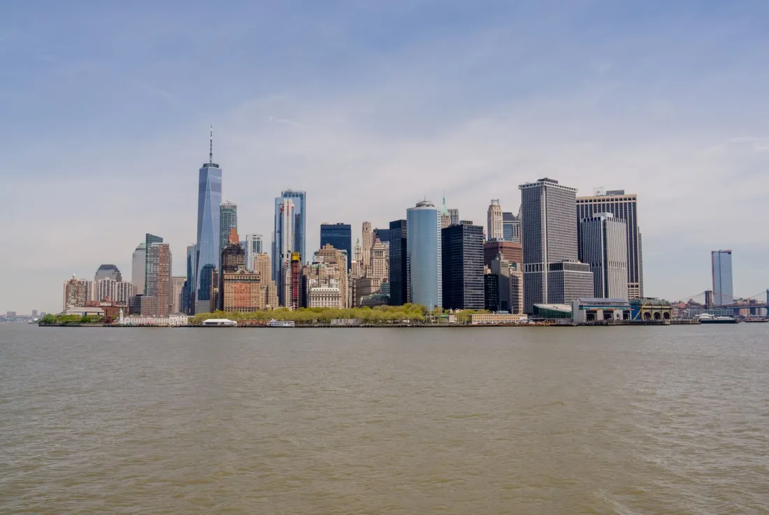 Lower Manhattan skyline seen from the water, illustrating how to enforce a UK judgment in the US under state recognition law