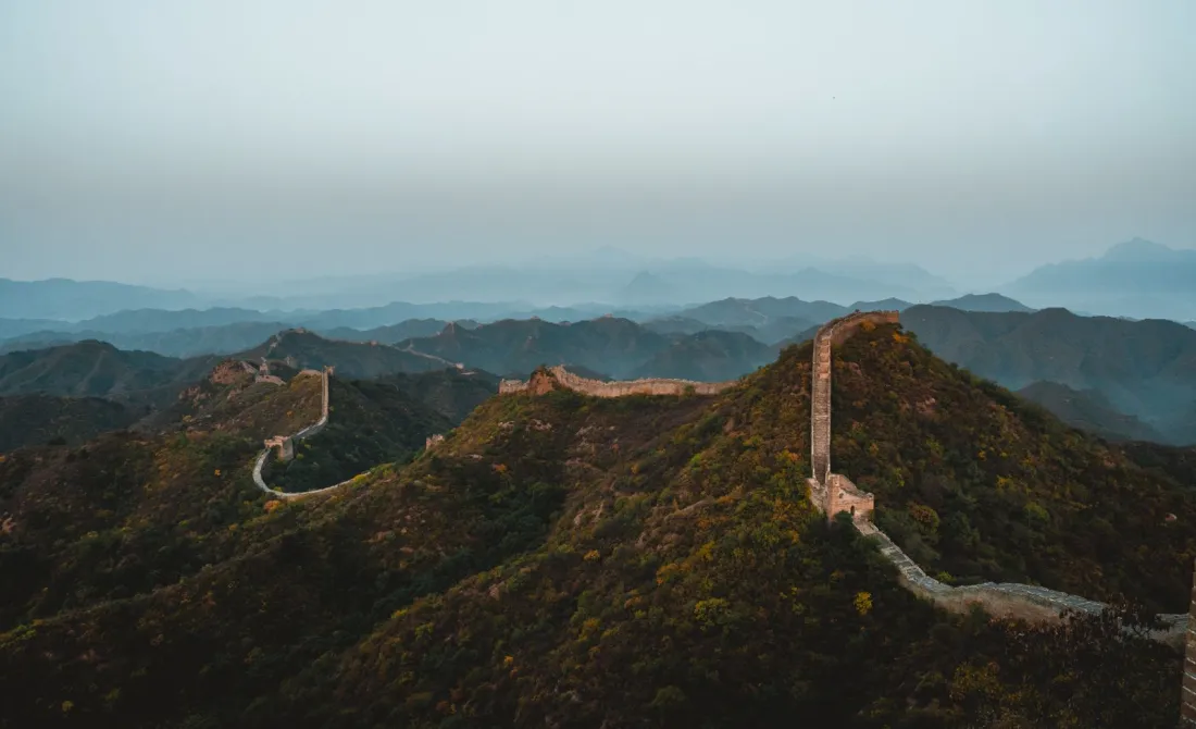 The Great Wall of China crossing forested ridges at dusk, illustrating trademark squatting in China and first-to-file risk when registering a trademark internationally