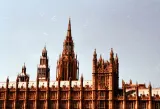 Gothic towers of the Palace of Westminster against a pale sky, illustrating the Employment Rights Act 2025 employer checklist and key dates