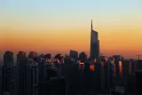 Dubai skyline at sunset with high-rise towers, illustrating how to open a business in Dubai