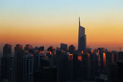 Dubai skyline at sunset with high-rise towers, illustrating how to open a business in Dubai