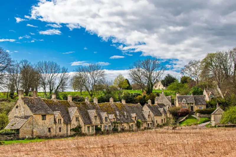 Cotswold village with historic stone houses in spring, England: insolvency & restructuring lawyers in England