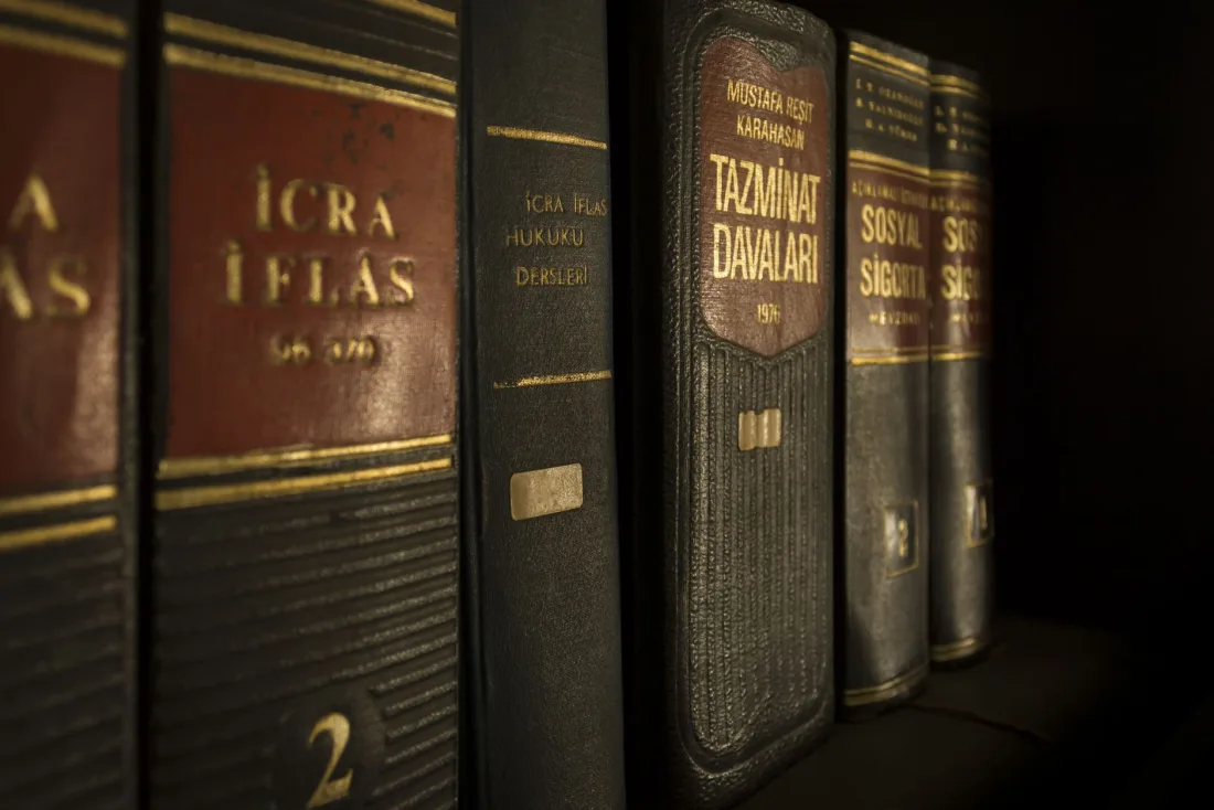 Shelved law reports and statute books, the primary sources lawyers must check to catch AI hallucinations in court filings