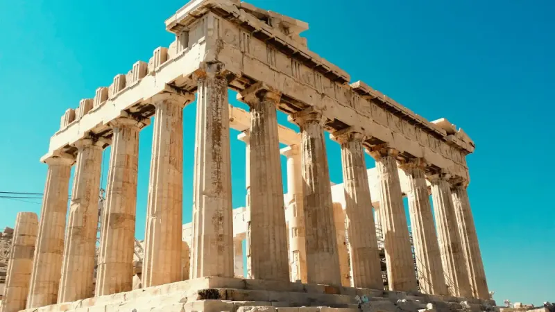 The Parthenon on the Acropolis against a clear blue sky, Athens, Greece: lawyers and advisers in Greece