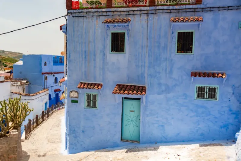 Blue-washed houses and a stepped lane in Chefchaouen, Morocco: lawyers and advisers in Morocco