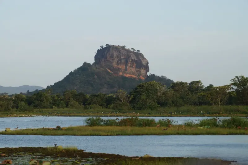 Sigiriya Rock Fortress rising above greenery and water, Sri Lanka: lawyers and advisers in Sri Lanka