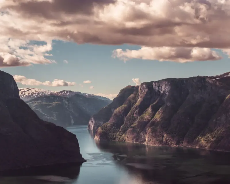 Aurlandsfjord between steep mountains at sunset near Flåm, Norway: lawyers and advisers in Norway