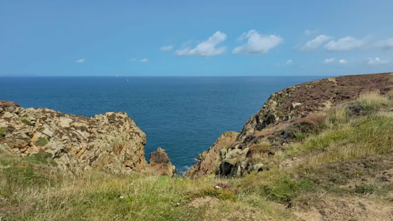 Rocky cliffs and sea at Grosnez on the north-west coast of Jersey: lawyers and advisers in Jersey