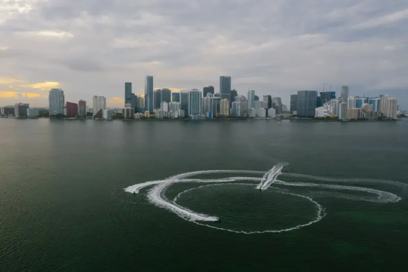 Miami skyline across Biscayne Bay with watercraft wake patterns, Florida: lawyers and advisers in Florida