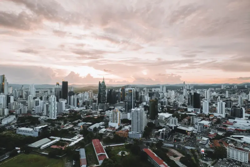 Aerial view of the Panama City skyline under a sunset sky, Panama: lawyers and advisers in Panama