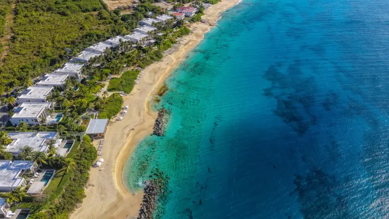 Aerial view of a sandy shoreline and turquoise water, Anguilla: lawyers and advisers in Anguilla