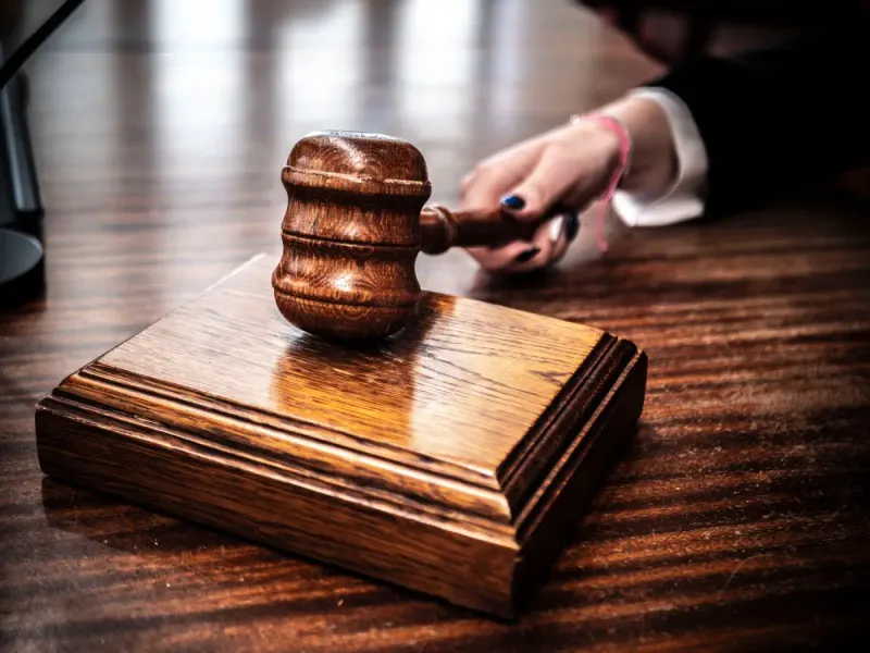 Wooden gavel on a judge's desk in a courtroom: dispute resolution & litigation news and analysis