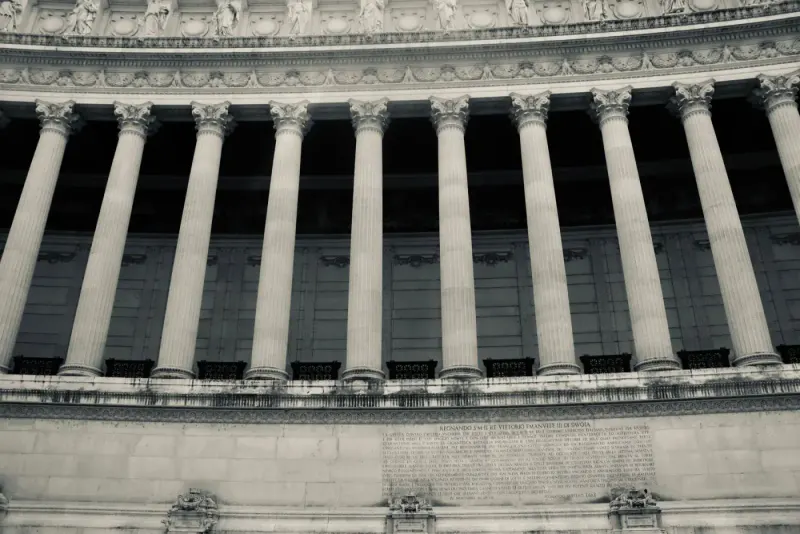 Neoclassical columns on a government building facade: regulatory & public lawyers and advisers