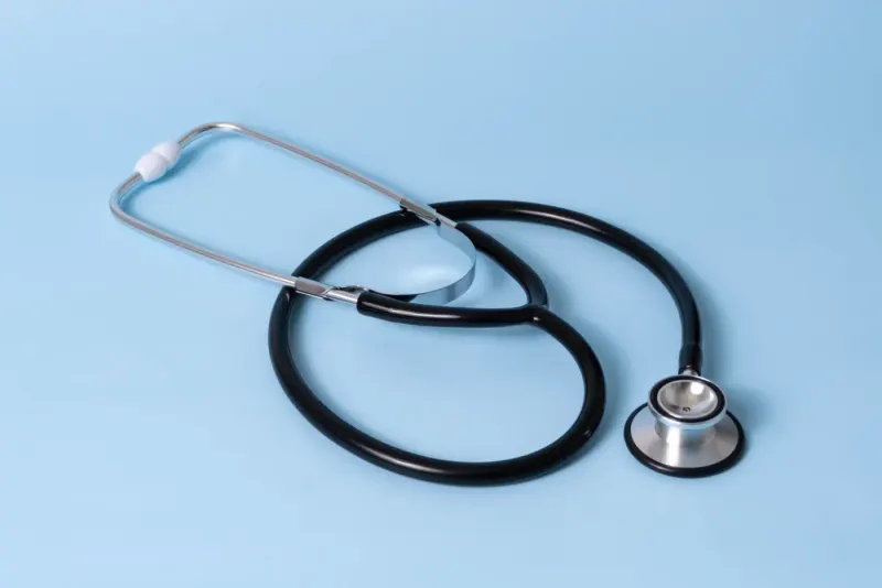 Stethoscope on a light blue background: healthcare & personal injury lawyers and advisers