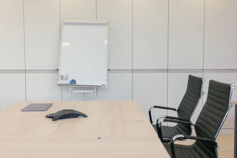 Empty conference room with chairs, table and whiteboard: management experts and advisers