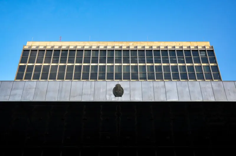 Government building facade against a blue sky, Montevideo: internal & government investigations experts and advisers