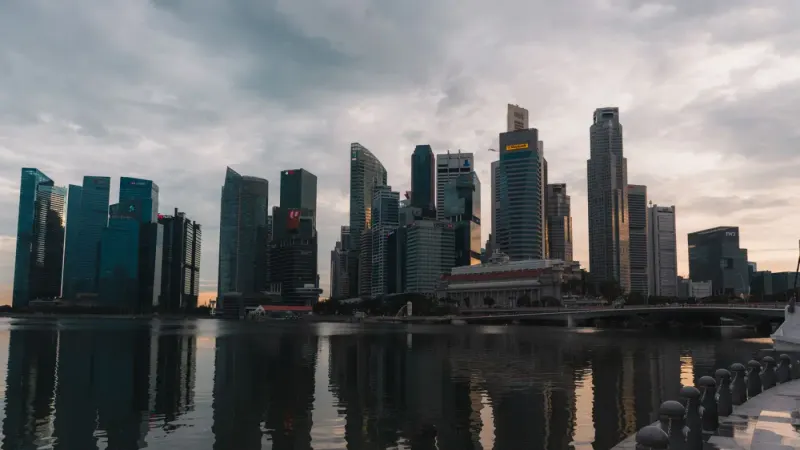Singapore CBD skyline at dusk reflected in Marina Bay: lawyers and advisers in Singapore