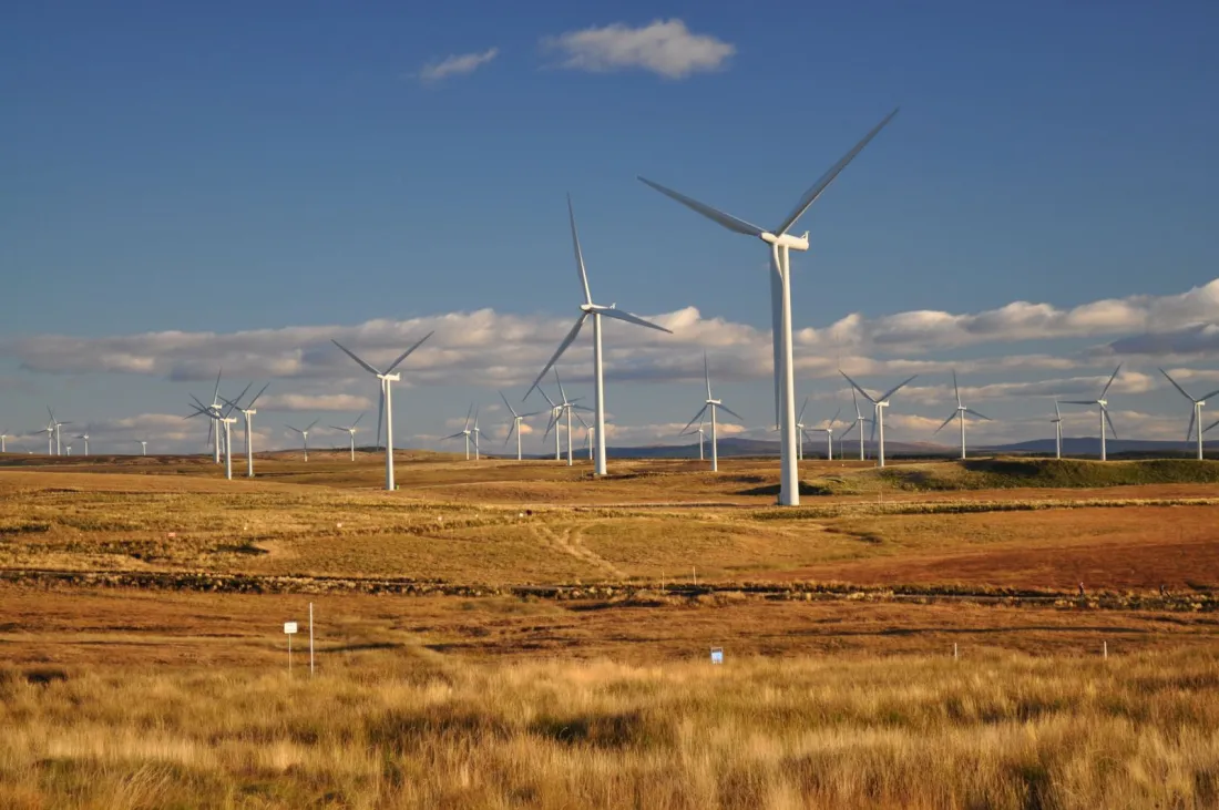 Wind turbines on open moorland in Scotland, illustrating the energy sector behind the question of whether redress payments are tax deductible