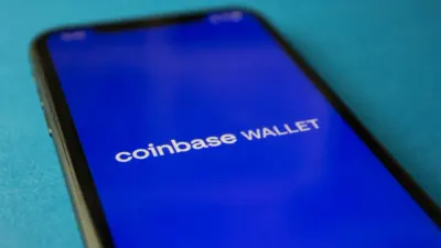 Smartphone showing a Coinbase app screen, illustrating why Coinbase was fined by the Central Bank of Ireland