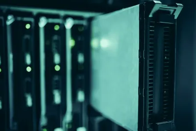 Server racks in a data centre with status lights, illustrating how to respond to a data breach