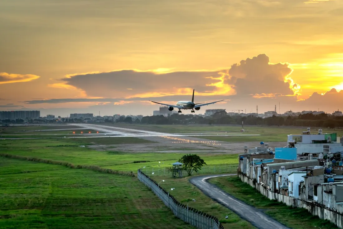 Aircraft landing at sunset, representing historic slots and the CJEU slot ruling for EU airports