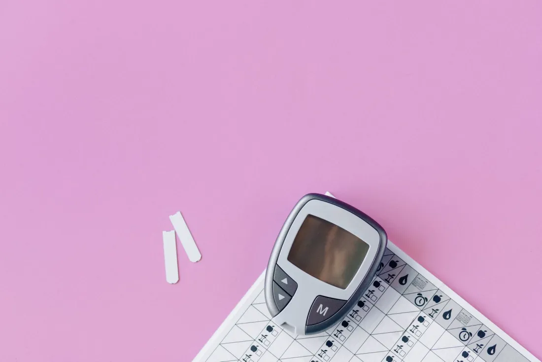 Blood glucose meter and test strips on a pink surface, a measuring device showing why medical devices need to be CE marked under the right risk class