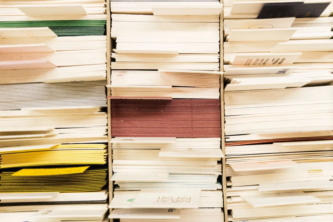 Stacked paper files in an archive, showing why records matter in claims made vs occurrence insurance
