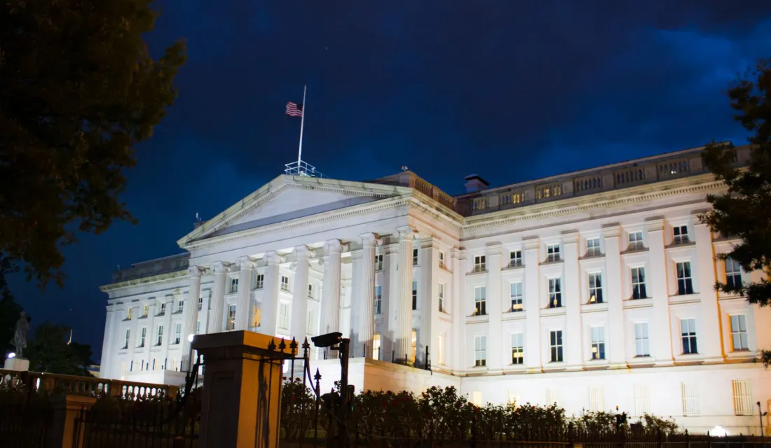 The US Treasury building in Washington at night, where the COINS Act biotech rules were proposed