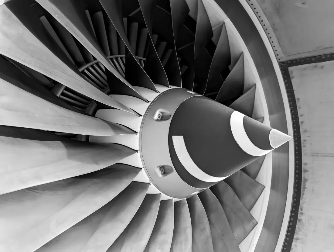 Black and white close-up of a jet engine fan, representing aircraft leasing insurance and maintenance risk under a dry lease