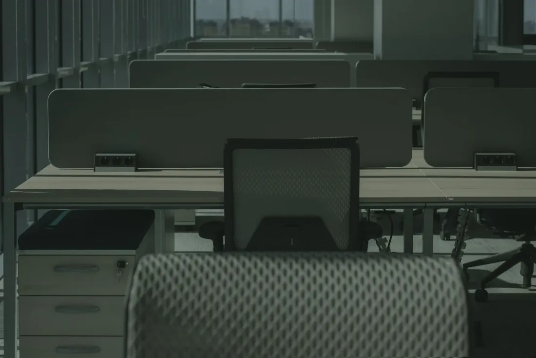 Empty desks in a dark open plan office, illustrating the creditor and director risks behind company insolvencies in September 2026